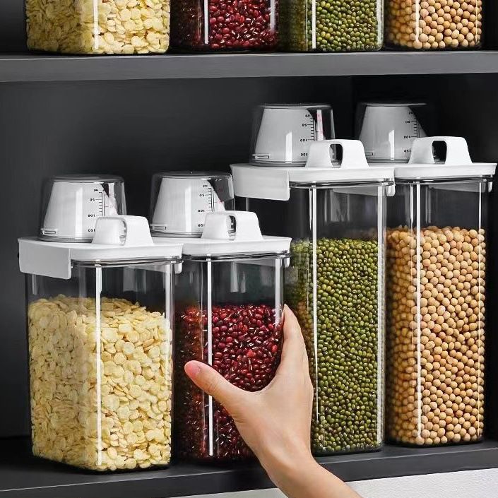 Storage containers with measuring cup